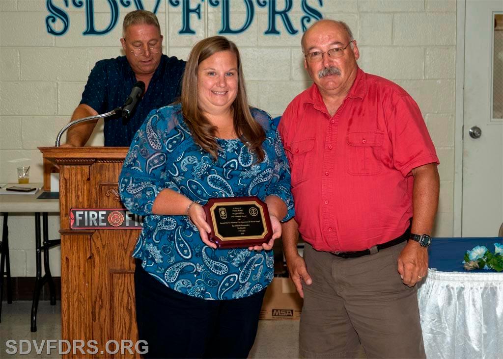 Fuzzy Knott's daughter LeeLee accepts a posthumous award for her father's many years of dedicated, continuous, and selfless service to the SDVFDRS. 