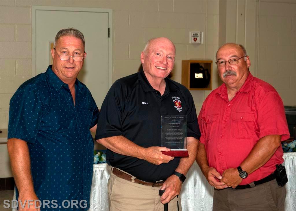 Mike Roberts is presented with the Harry M. Koehler Memorial Award by President Ed Stauffer and Chief Gary Joy.