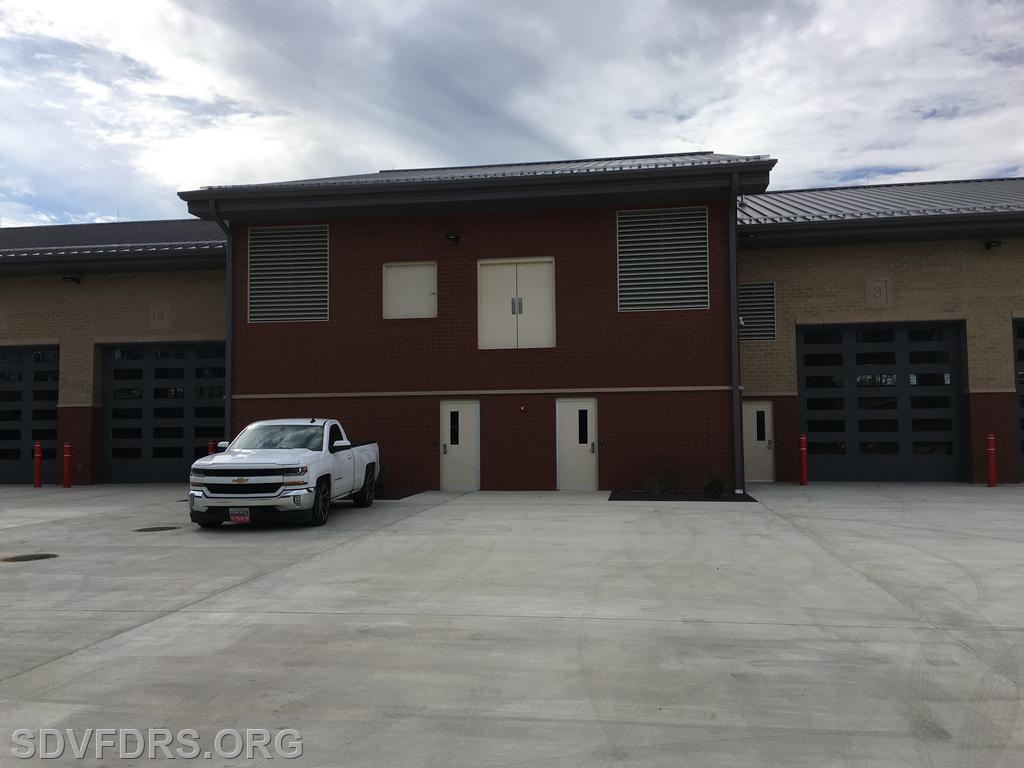 Rear of Building Entry Gear Storage Rooms with Window and Doors above for Ground Ladder and Rescue Training.