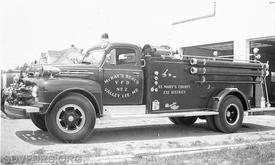 Engine 62 sitting in front of the McKay's Beach VFD circa 1950s. (Check out the old "battle lantern" style hand light mounted just to the rear of the driver's door.)