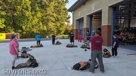 Fire Lt. Brian Stauffer teaches the new members about their gear.
