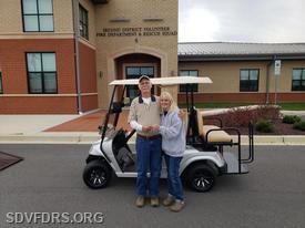 DeeDee Johnson, SDVFD&RS Fundraising Committee Chairperson, hands over the keys of a brand new golf cart to Piney Point resident Jimmy Goddard. Congratulations Jimmy!